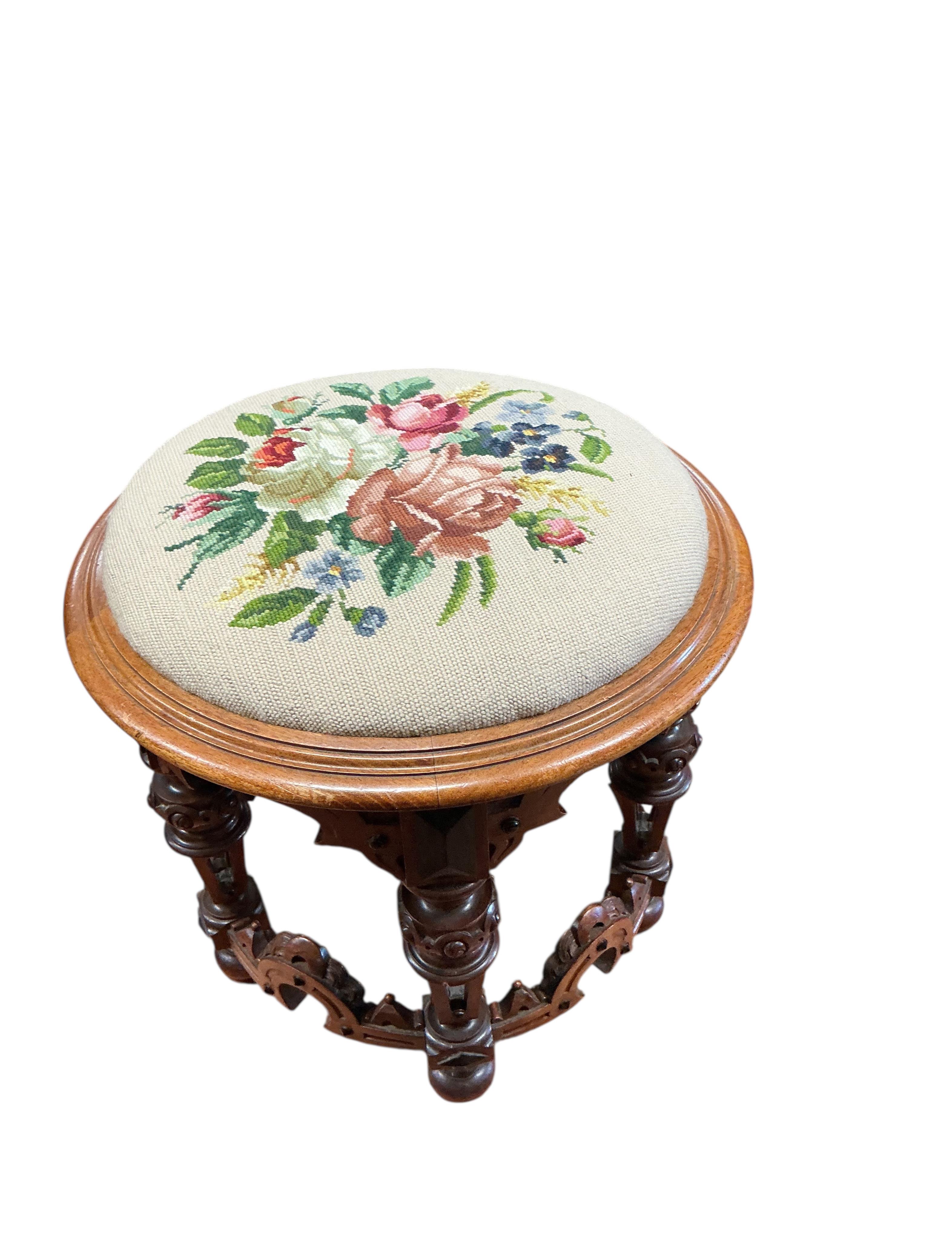 A Victorian circular mahogany stool with drop-in tapestry seat, diameter 48cm, height 44cm